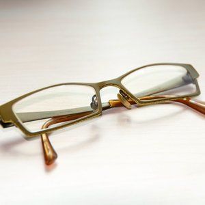 Prodesign olive green eyeglass frame with Shade Control sunglass clip